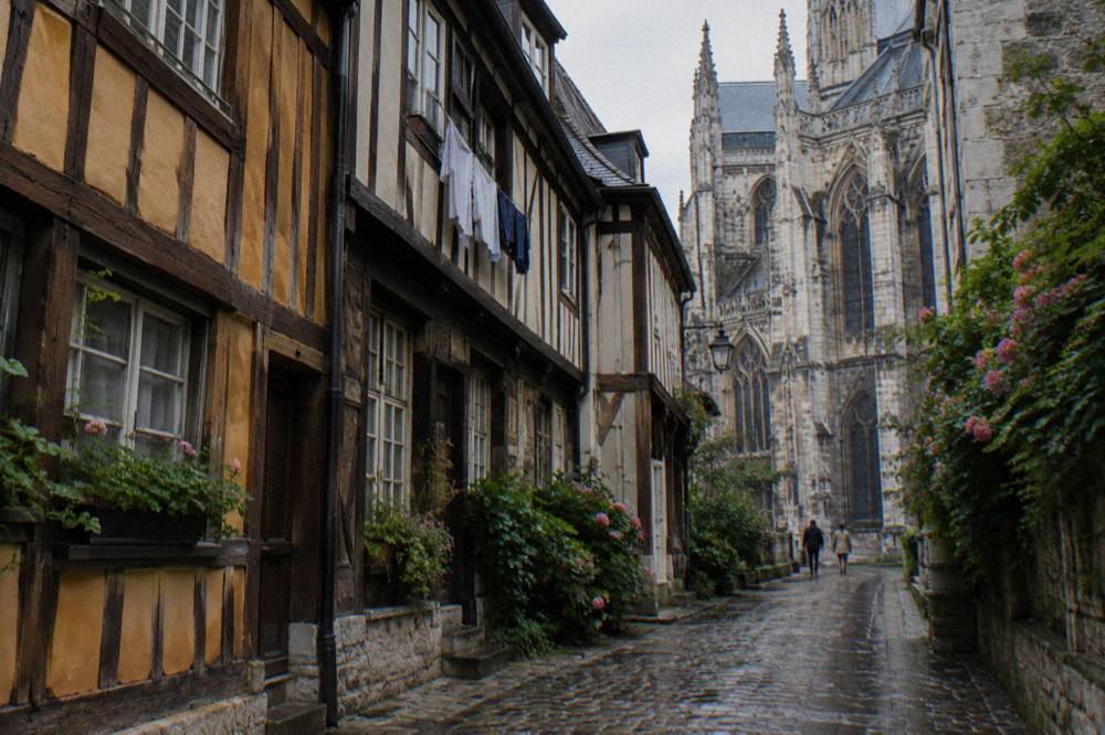 Timber-framed houses on a cobbled street in Rouen near the cathedral