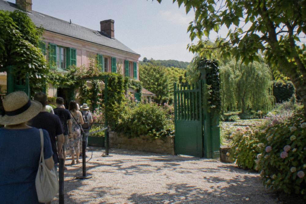 Entrance gate and ticket line in front of Monet's house in Giverny