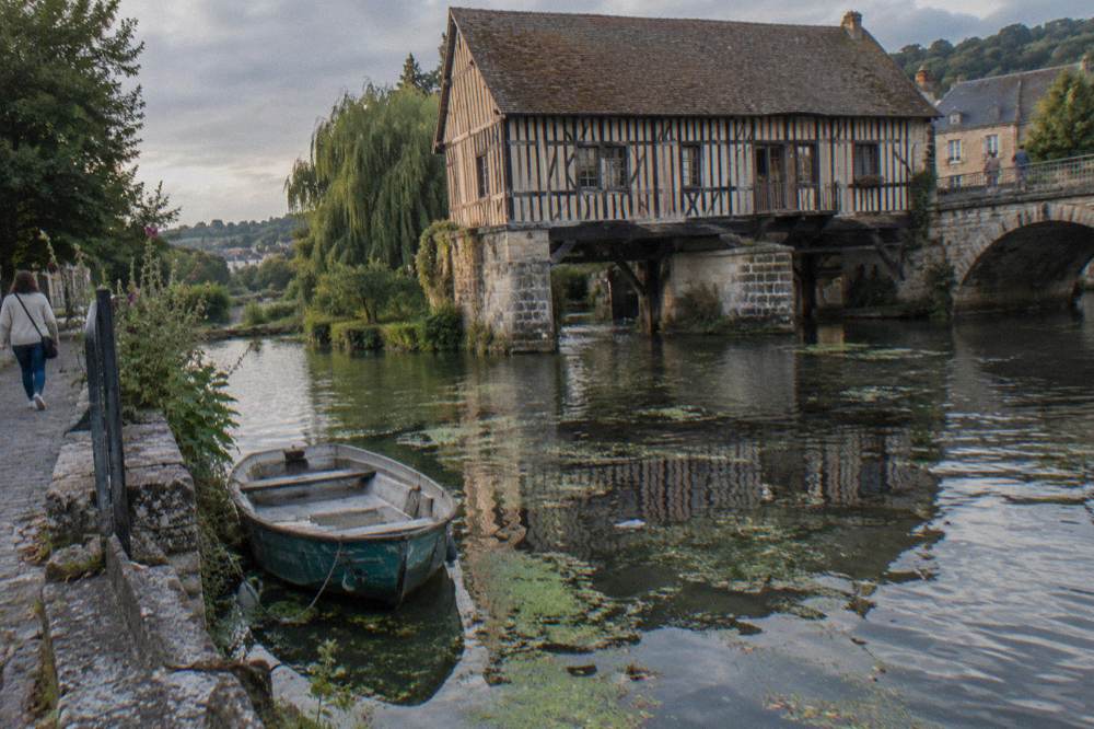 Half-timbered old mill on the Seine river beside the bridge at Vernon