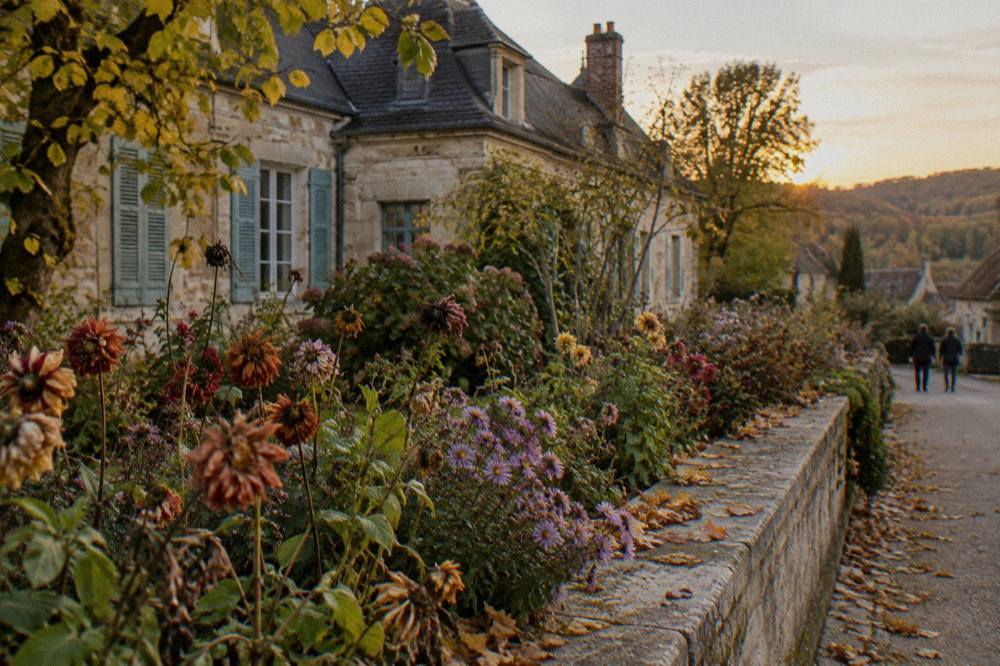 Museum entrance and flower beds along a village lane in Giverny