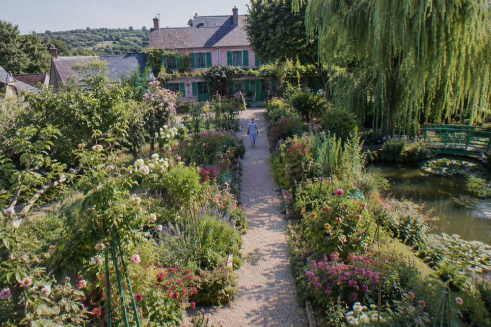 Flower beds and gravel paths in the Clos Normand garden in front of Monet's house in Giverny