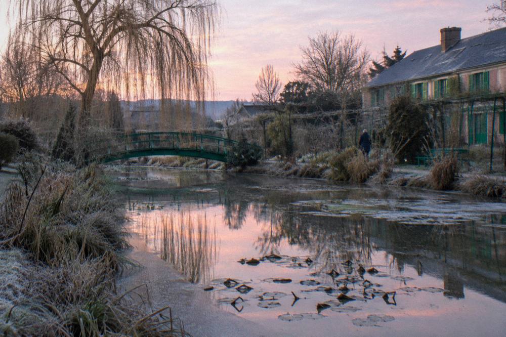 Water lily pond with the Japanese bridge in early morning light before visitors arrive